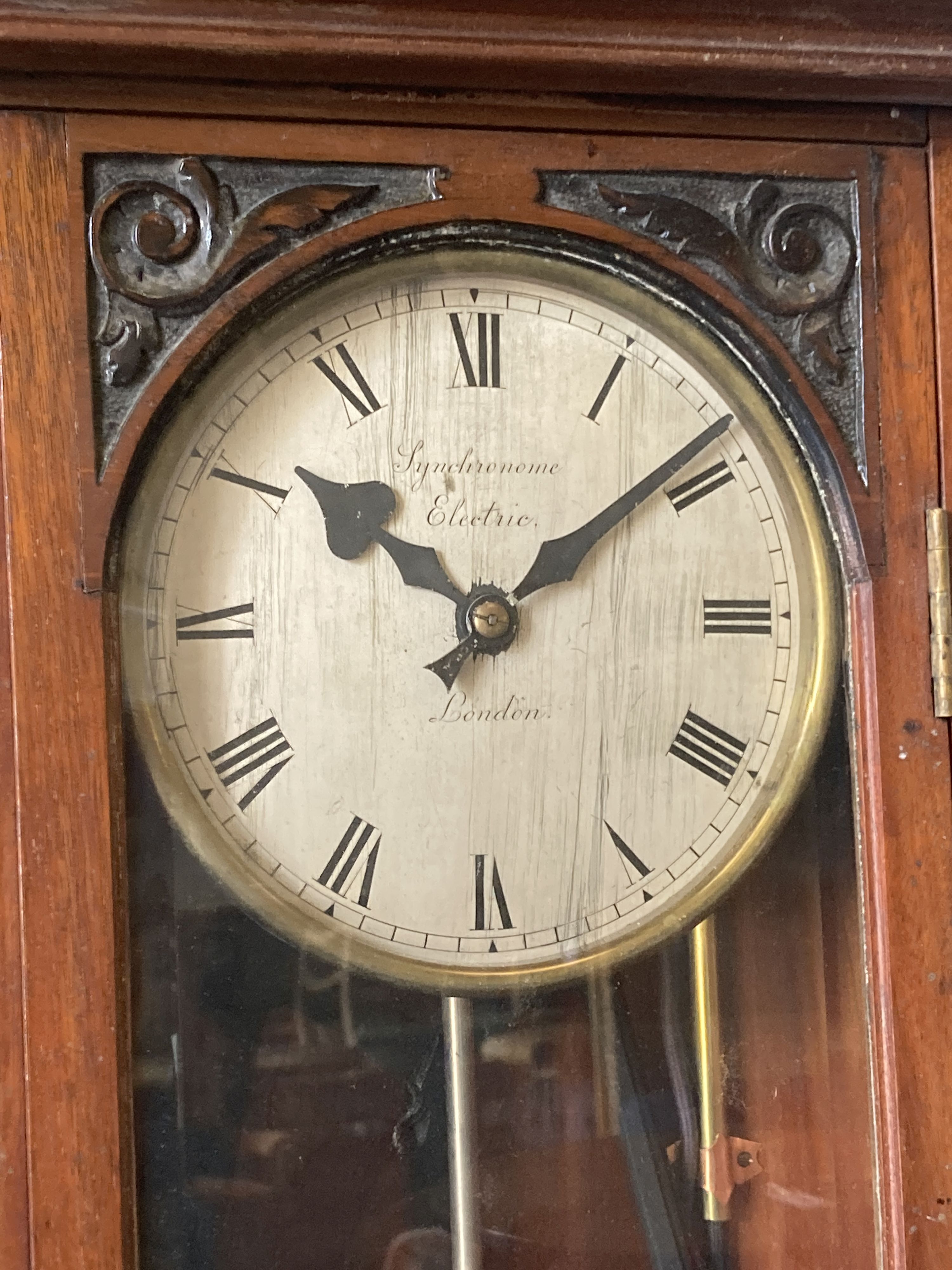 A Synchronome electric carved mahogany master wall clock, NRA 456, height 136cm